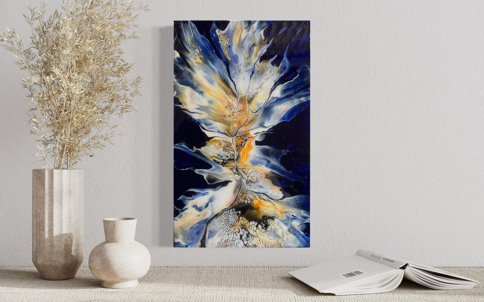 “Flare”- This painting features a striking combination of radiant gold and pure white dramatically against a deep blue backdrop. The careful blend of colours creates a mesmerising illusion, reminiscent of a brilliant flare illuminating the night sky.